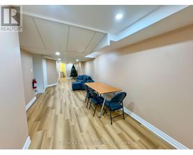 A conference room with a long table and chairs.