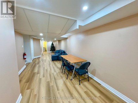 A conference room with a long table and chairs.