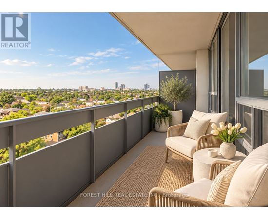 A balcony with a couch and a table with flowers on it.