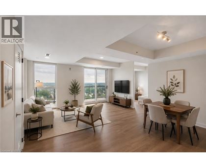 A well-lit, spacious living room with a dining area and a view of the city.