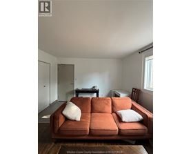 A living room with a couch and a coffee table.