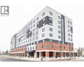 A large building with a lot of windows and a sign that says Thelinton.