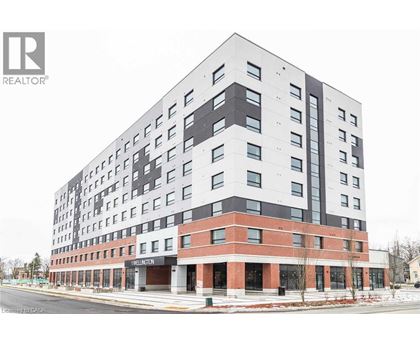 A large building with a lot of windows and a sign that says Thelinton.