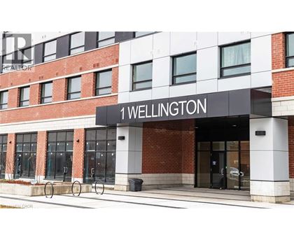 The front of a building with the words "1 Wellington" on it.