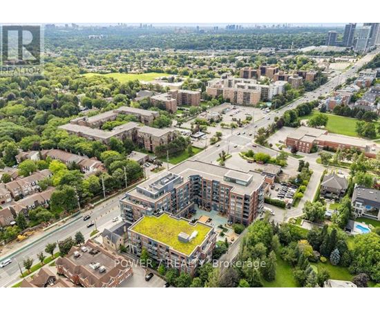 An aerial view of a residential area with apartment buildings and green spaces.