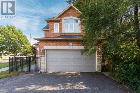 A house with a garage is for sale.