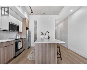 A modern kitchen with wooden cabinets and a white island.