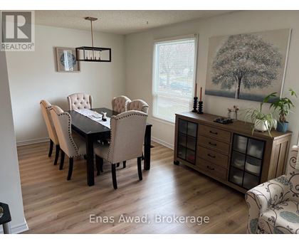 A dining room with a table set for six.