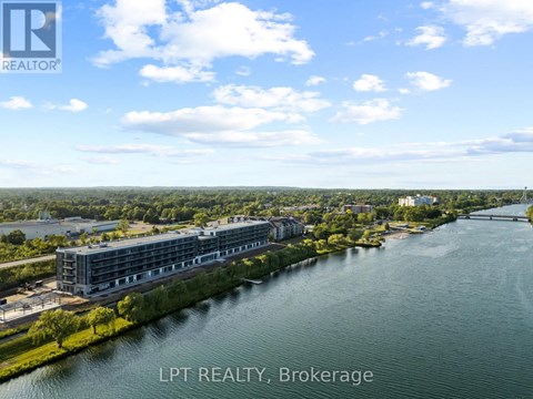 A real estate brokerage office overlooks a river.