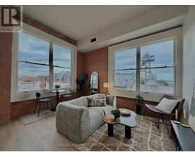 A living room with a couch, chair, and coffee table.