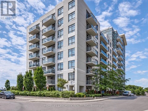 A tall residential building with balconies and the number 81 visible on the side.
