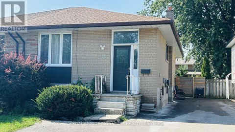 A house with a white door and a small front yard.