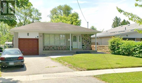 A house with a car parked in front of it.