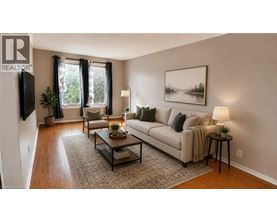 A living room with a couch, chair, and coffee table.