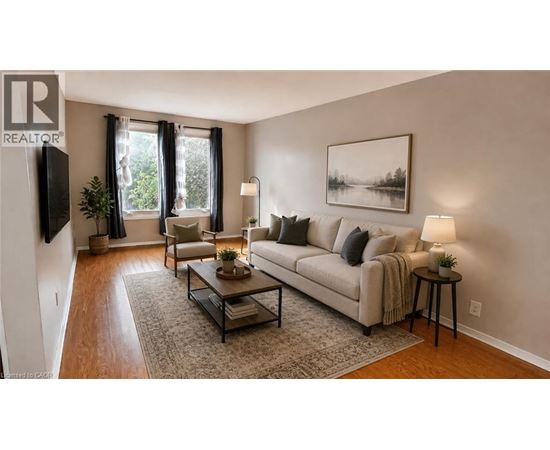 A living room with a couch, chair, and coffee table.