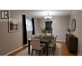 A dining room with a table set for four.