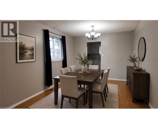 A dining room with a table set for four.