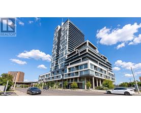 A modern multi-story building with a glass facade is the main focus of the image.