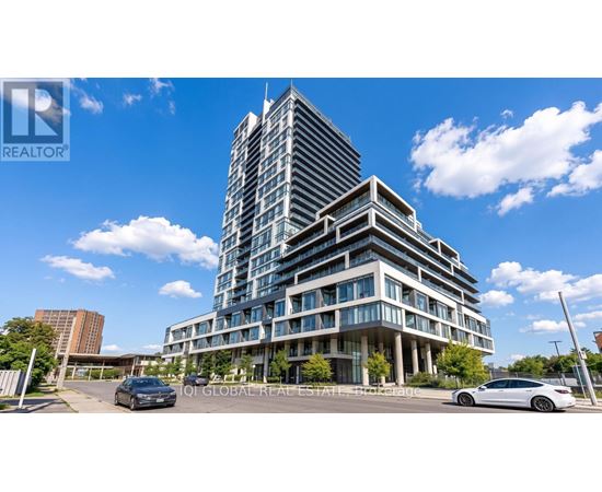 A modern multi-story building with a glass facade is the main focus of the image.