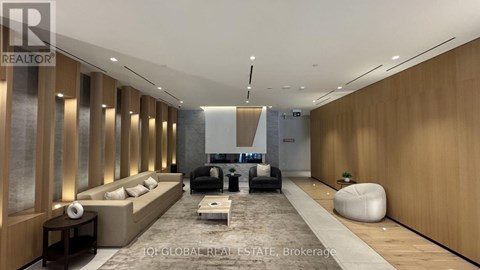 A modern living room with a long couch and a coffee table.