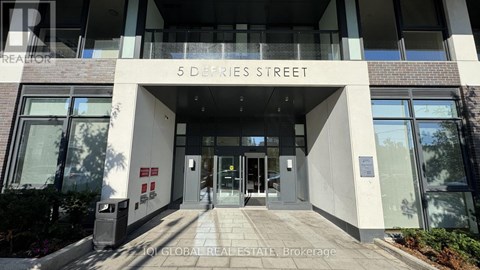 The front of a building with the words "5 DeFries Street" written above the entrance.