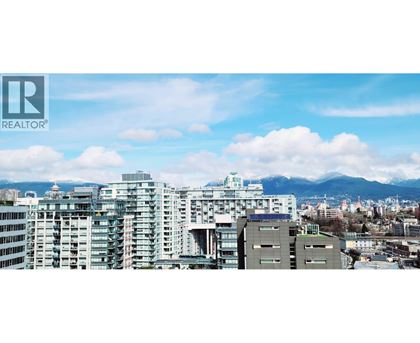 A cityscape with buildings and a Realtor logo.