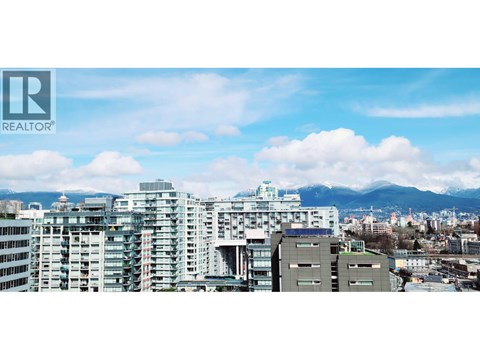 A cityscape with buildings and a Realtor logo.