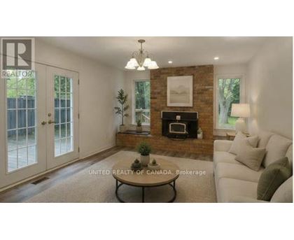 A living room with a fireplace and a couch.