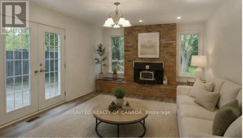 A living room with a fireplace and a couch.