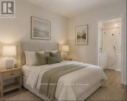A bedroom with a large bed and a painting on the wall.