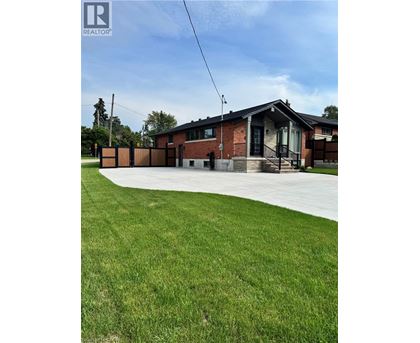A house with a lawn in front of it.