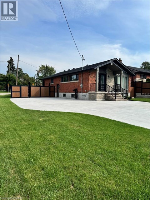 A house with a lawn in front of it.