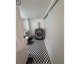 A black and white checkered floor in a bathroom.