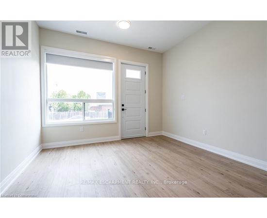 A room with a door and a window.
