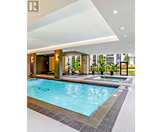 A swimming pool in a modern indoor setting.