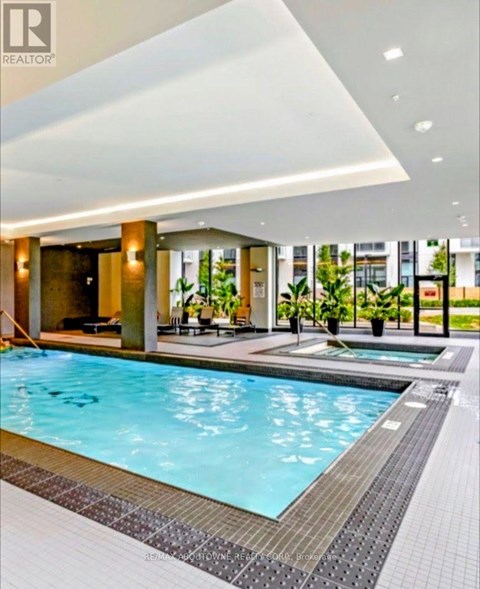 A swimming pool in a modern indoor setting.