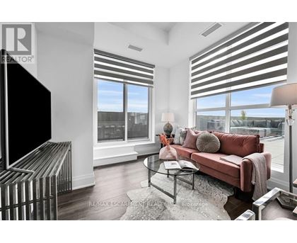 A living room with a red couch and a television.