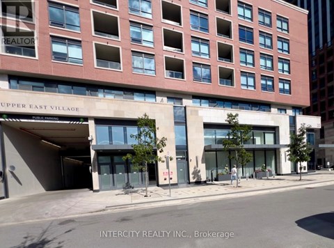 A building with the words "Upper East Village" on the front.