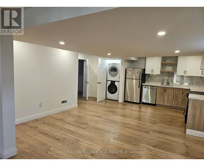 A kitchen with a washer and dryer built in.