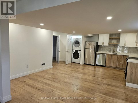 A kitchen with a washer and dryer built in.