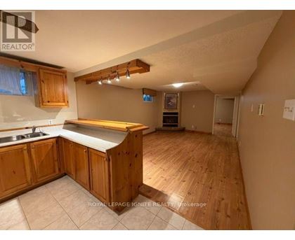 A kitchen with wooden cabinets and a countertop.