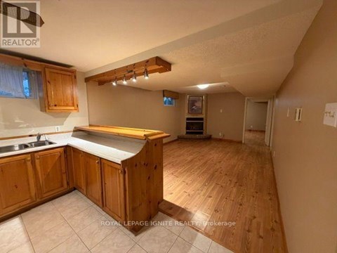 A kitchen with wooden cabinets and a countertop.