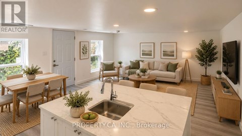 A well-lit, modern kitchen and living room with a dining table and chairs.