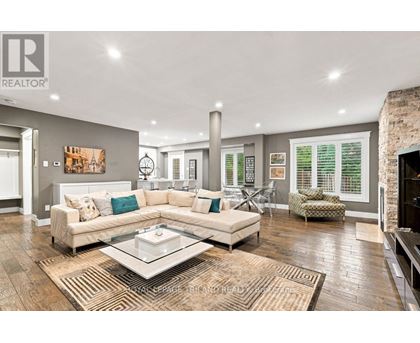 A living room with a white couch and a coffee table.