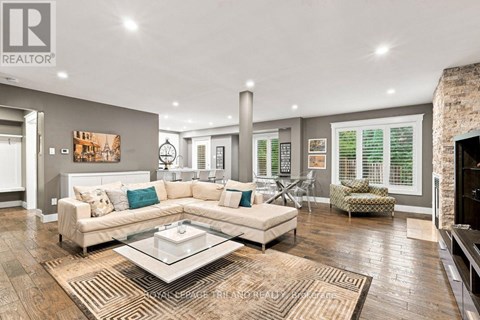 A living room with a white couch and a coffee table.