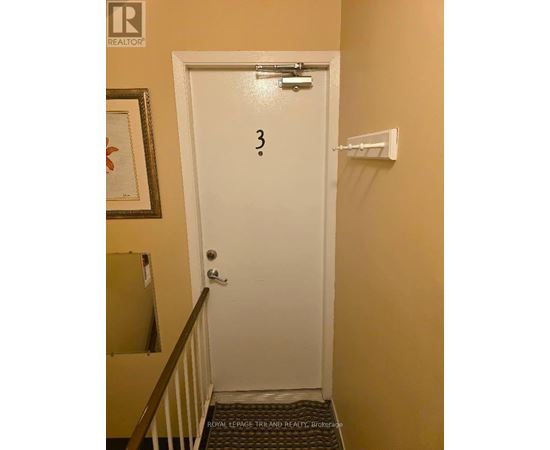 A white door with a number 3 written on it.