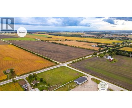 A real estate brokerage firm is advertising a property in the image.