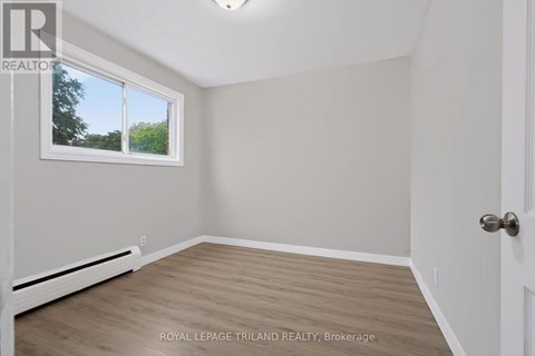 A room with a window and a door.