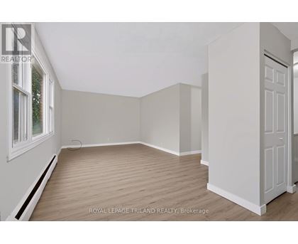 A white door is on the right side of the room.
