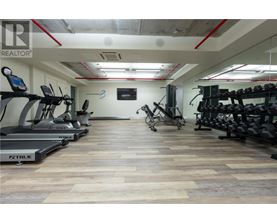 A gym with treadmills and exercise bikes.
